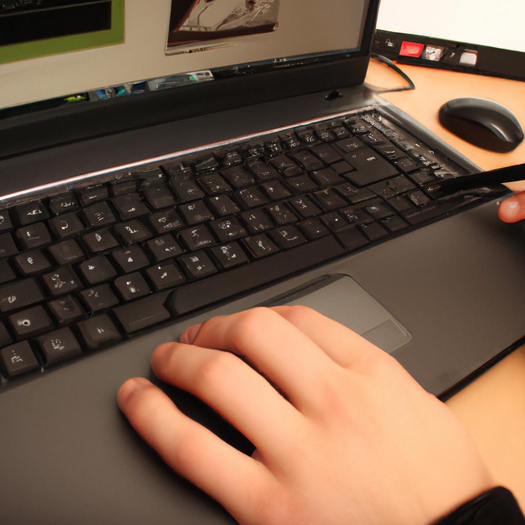 Person using laptop, designing website